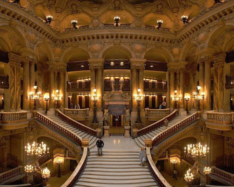 The ornate and opulent grand staircase at Opera Garnier in Paris.