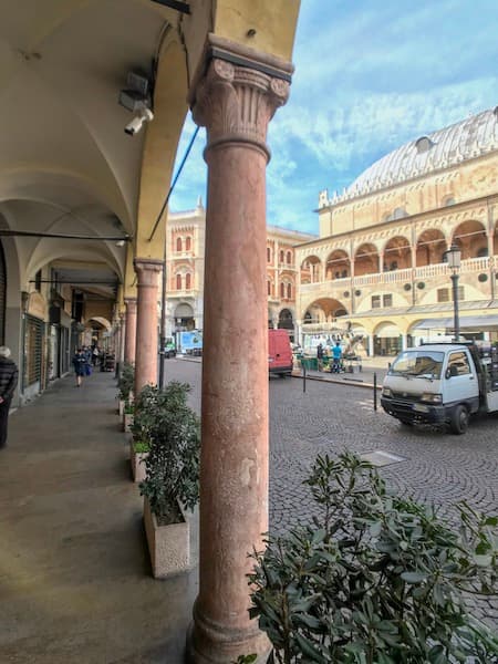 Arcaded street with ornate pillar, Padua