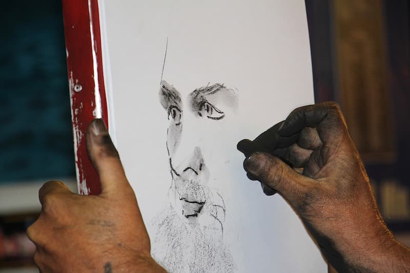 Charcoal portrait during an artist-themed river cruise