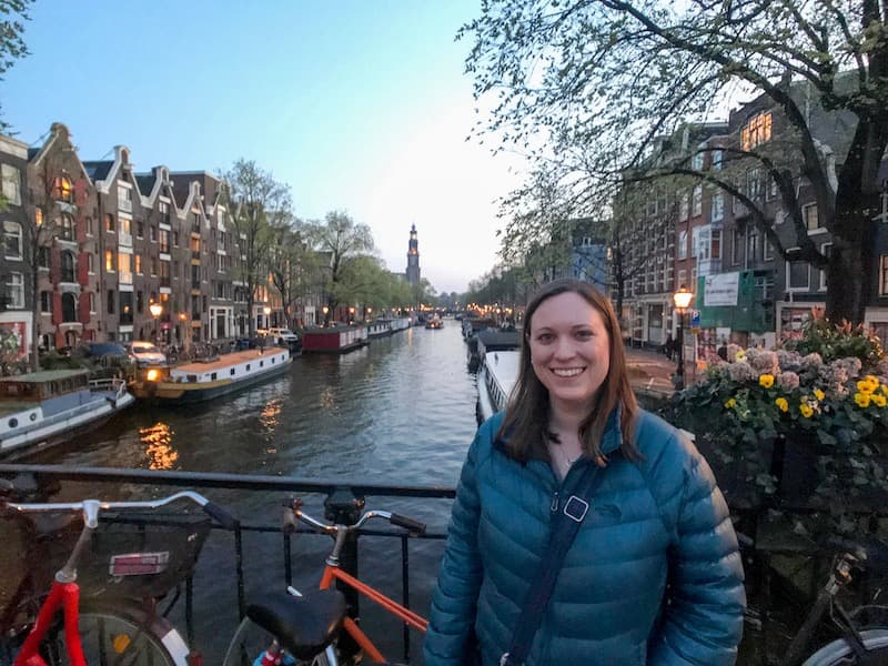 Cassie Tetro standing on a bridge over a canal in Amsterdam