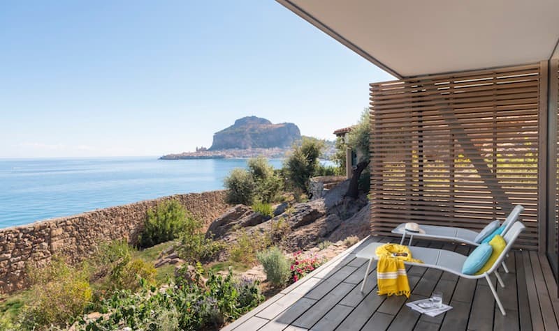 Photo of two lounge chairs looking at the ocean from the Club Med in Cefalu, Sicily.