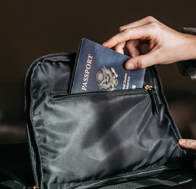 A US Passport being put into a purse