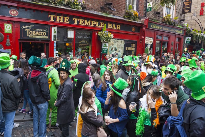 People celebrating in the streets outside of the famous Temple Bar pub in Dublin