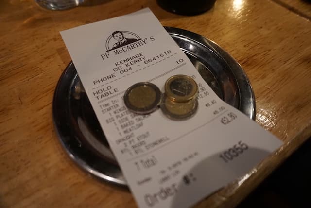 Euro coins left as a tip at a restaurant in Europe