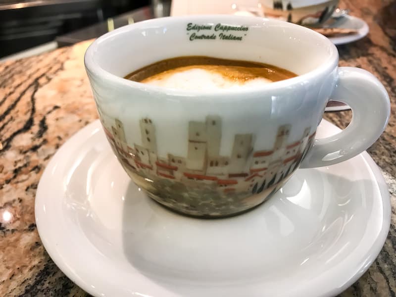 Ornate Ancap cappuccino cup with coffee inside