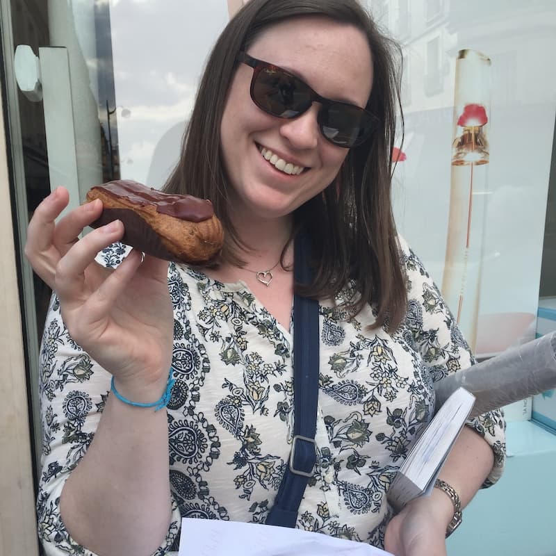 Cassie Tetro with a chocolat eclair in Paris