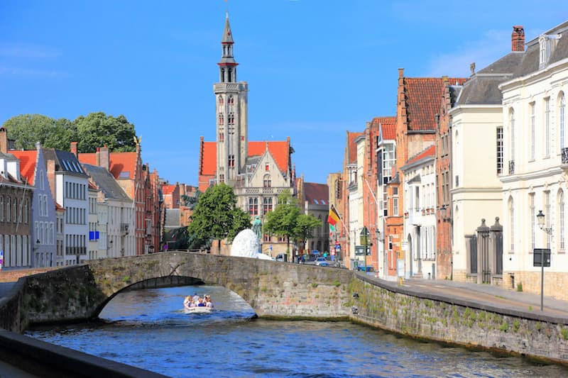Canal and canal boat in Bruges, Belgium.