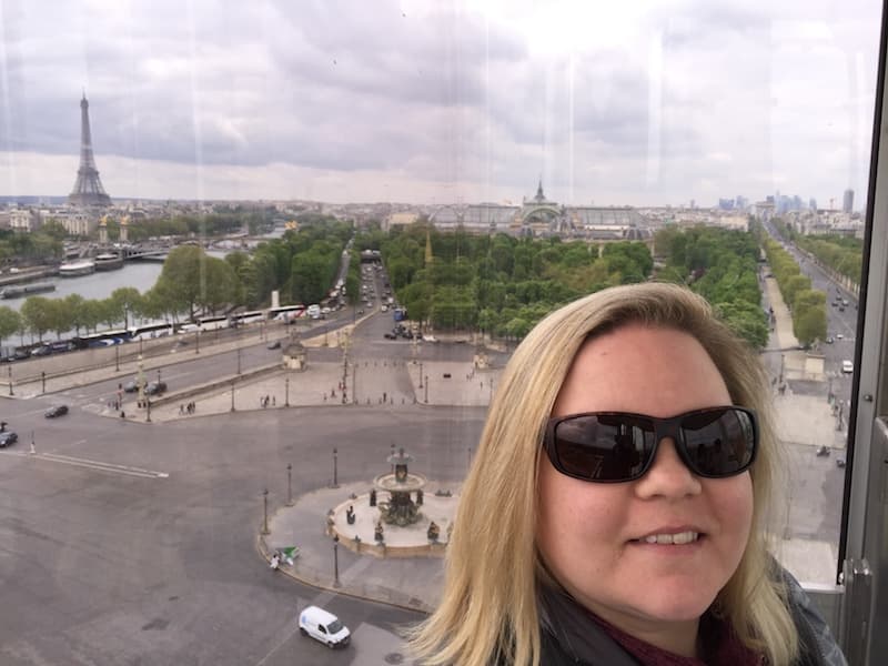 Clarice with view of Eiffel Tower from the Paris ferris wheel