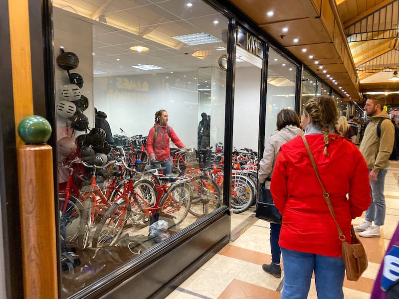 Bike tour guide handing out bikes to the tourists