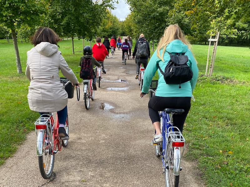Group of people biking on the grounds of Versailles
