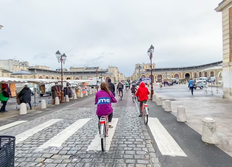 Bike tour arriving at the Versailles Food Market